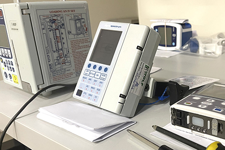 Photo of an infusion pump on a desk