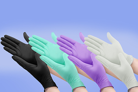 Photo of hands wearing black, teal, purple and white surgical gloves